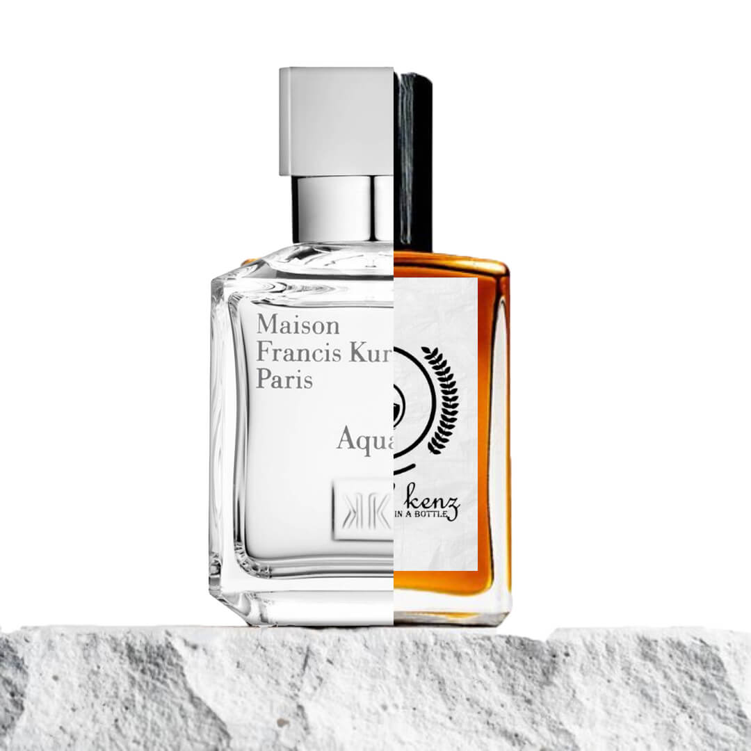 "A split image features two perfume bottles set on a white stone surface."
"On the left, a clear bottle with the label Aqua Celestia by Maison Francis Kurkdjian."
"The bottle has a clean, transparent design with elegant typography on the label."
"On the right, an amber-colored bottle, an inspired version of Aqua Celestia by Baytulkenz."
"The amber bottle mirrors the design of the original, with a distinctive logo and a warm, rich hue."