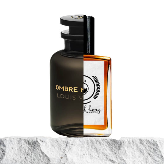 "Two designer perfume bottles sit side by side on a textured stone surface."
"On the left, a black bottle labeled "Ombre Nomade Louis Vuitton" with a sleek, modern design."
"On the right, an amber-colored bottle, inspired by "Ombre Nomade," reflecting a similar elegant shape."
"The Baytulkenz version on the right features a warm amber hue, offering a luxurious appearance."
"Both bottles stand out with their high-end appeal, showcasing the contrast between the dark and amber tones."