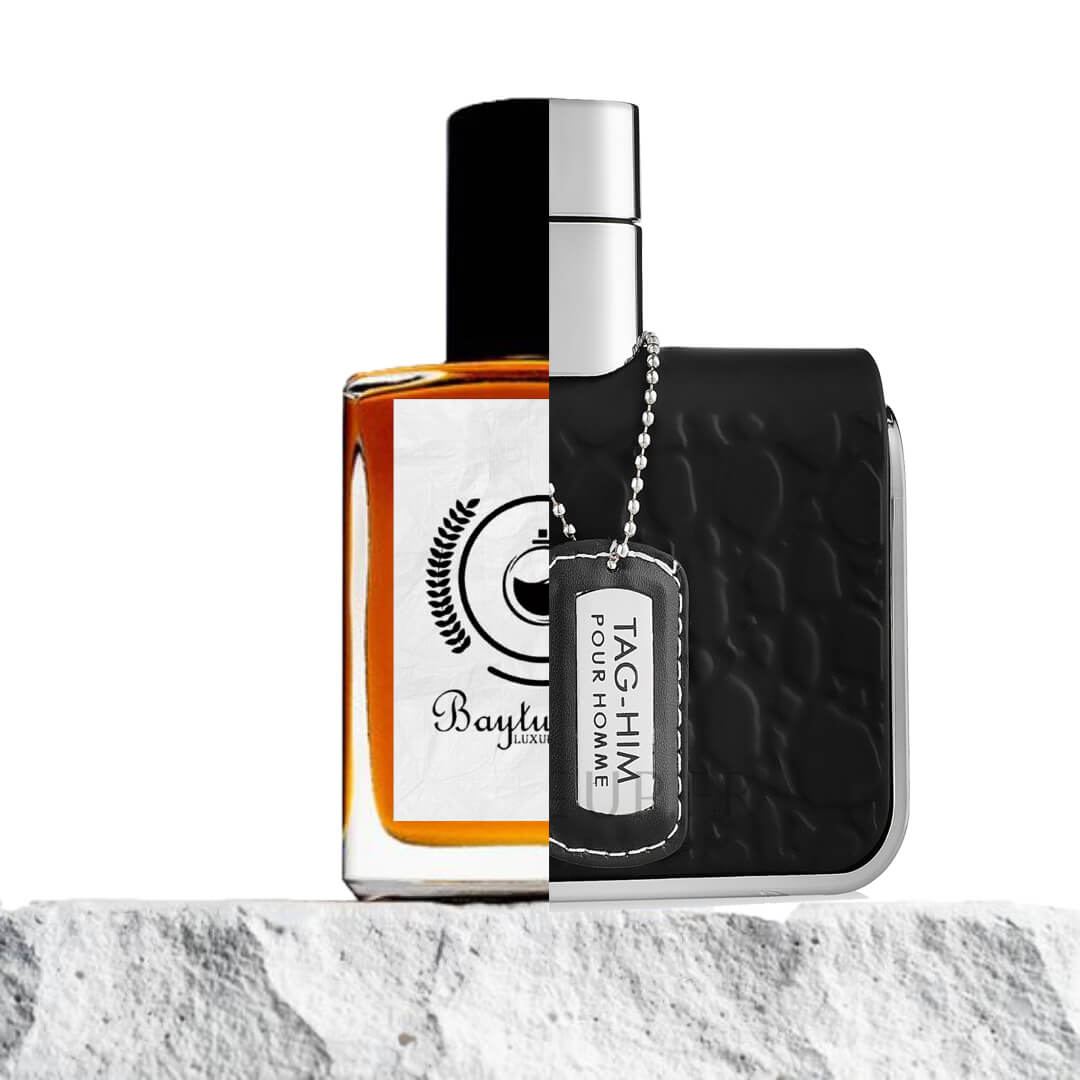"Two cologne bottles are placed on a textured surface."
"On the left, an amber-colored bottle represents the Baytulkenz inspired version of "Tag Him Armaf."
'On the right, a black-colored bottle is labeled "Tag Him Armaf," featuring a bold, sleek design."
"The amber bottle contrasts with the bold black bottle, emphasizing their color differences and distinct styles."